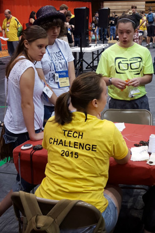 Brandilyn Stockton-Fresso (‘15) speaks to a worker at the Tech Challenge competition. Stockton-Fresso was the first student from Lake Central to compete at the international level. Photo submitted by Mr. Ray Palasz, English.