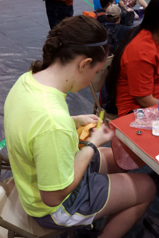 Brandilyn Stockton-Fresso (‘15) sews a button at Tech Challenge practice. Tech Challenge, a five hour event, allows technicians to demonstrate their speed and accuracy in technical theater skills. Photo submitted by Mr. Ray Palasz, English.