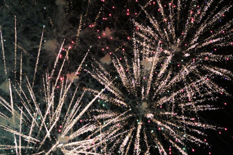 Multiple fireworks illuminate the sky. During the finale, multiple fireworks were set off at the same time.