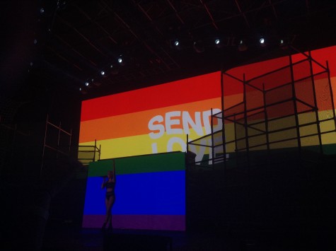 The “send love” picture is shown on the screens at the end of her performance of “New Americana”. This picture was released by her originally the day after the attack at the nightclub in Orlando.