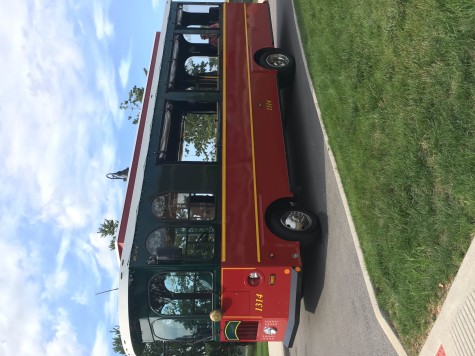 A Crown Point trolley waits in the parking lot for guests before the parade.  Players and family were able to take a tour of the town while riding in the trolley. 