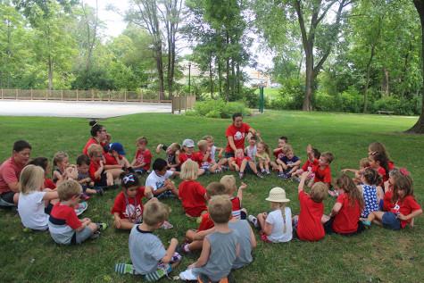 During camp, the kids gather in a circle to sing silly songs. There were 50 kids who attended Kiddy Kamp.