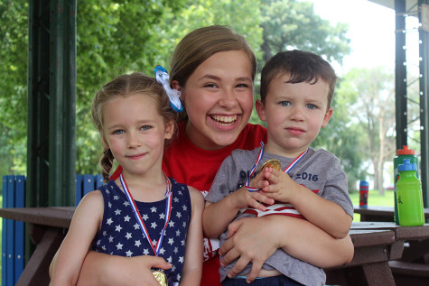 Katherine Morzy (10) poses with two campers on the last day of camp. This was Morzy’s third year volunteering.  