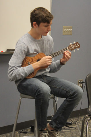 Mason Crawford (11) sings and plays the ukulele to “Can’t Take My Eyes off You” by Frankie Vallie and The Four Seasons. Crawford was appointed head of Open Mic Club this year. 