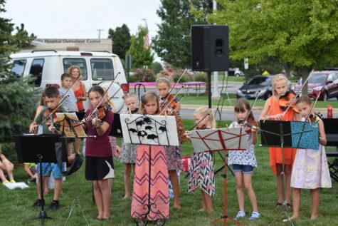 Young violinists perform during the Corn Roast. The violinists played two different songs. 